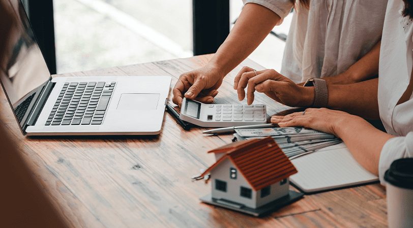 First time home builders: Planning and Budgeting with laptop 