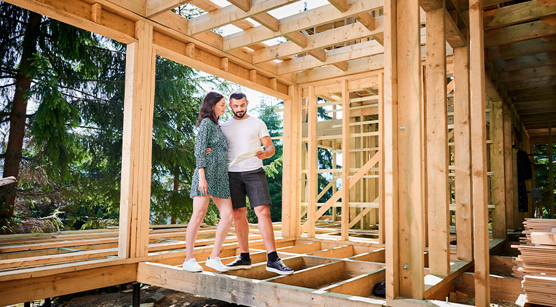 couple watching their home building 