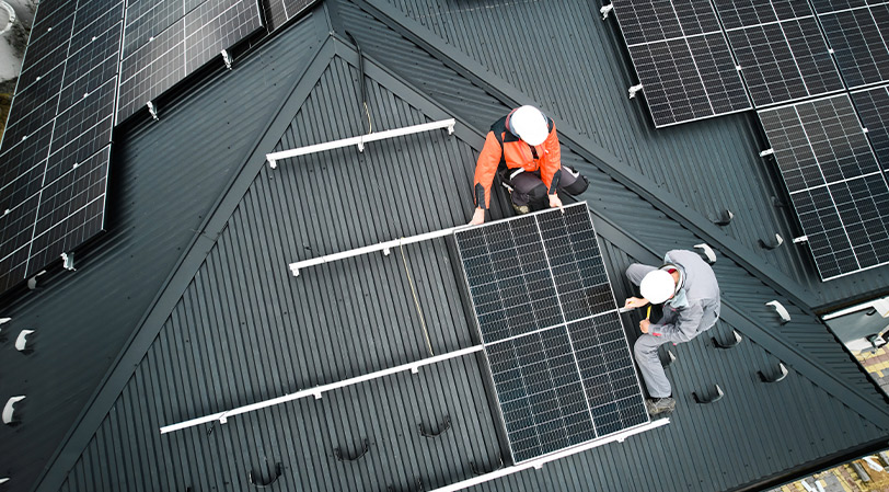 roofer installing solar panels